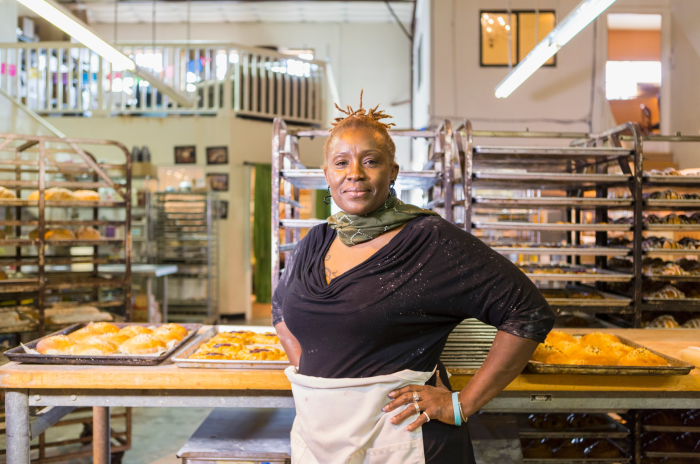 Baker standing in bakery kitchen