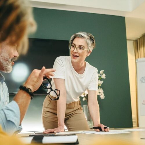 Happy businesspeople having a discussion during a meeting