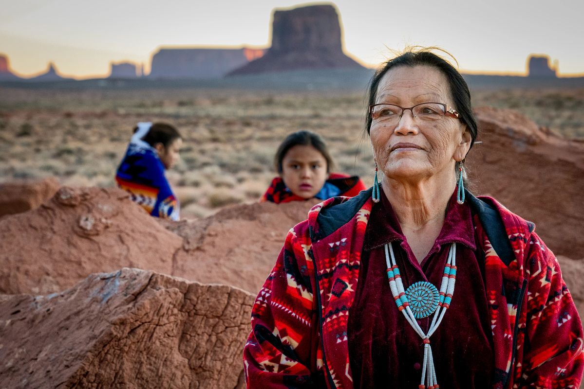 Native American Grandmother, Grandson and Granddaughter in Monument Valley Arizona at Dawn