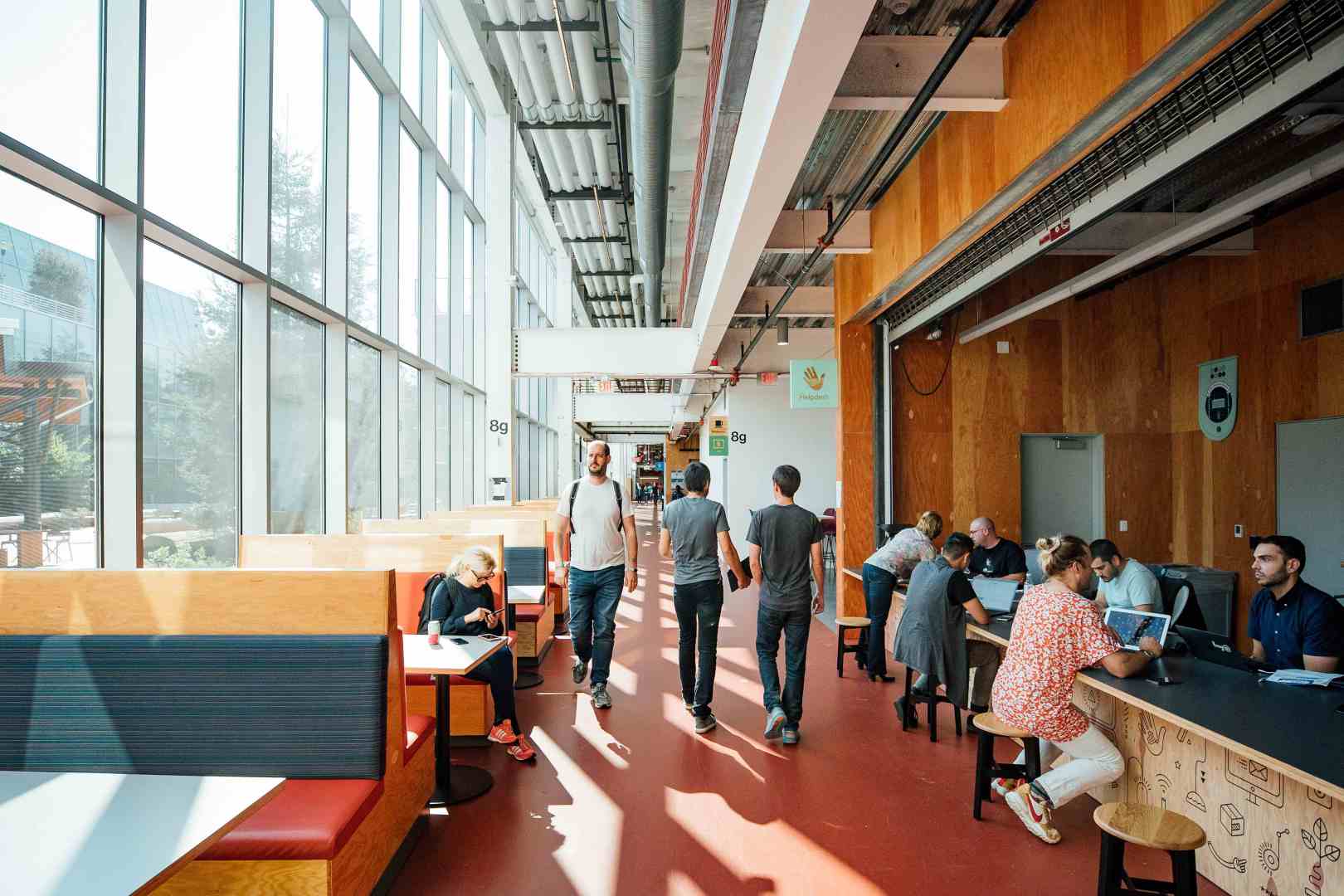 Pathway at Meta's Melo Park campus with employees coworking or walk through. 