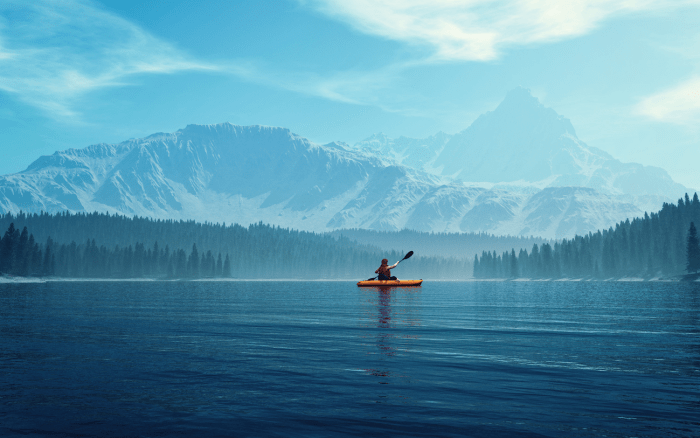 Person kayaking in lake