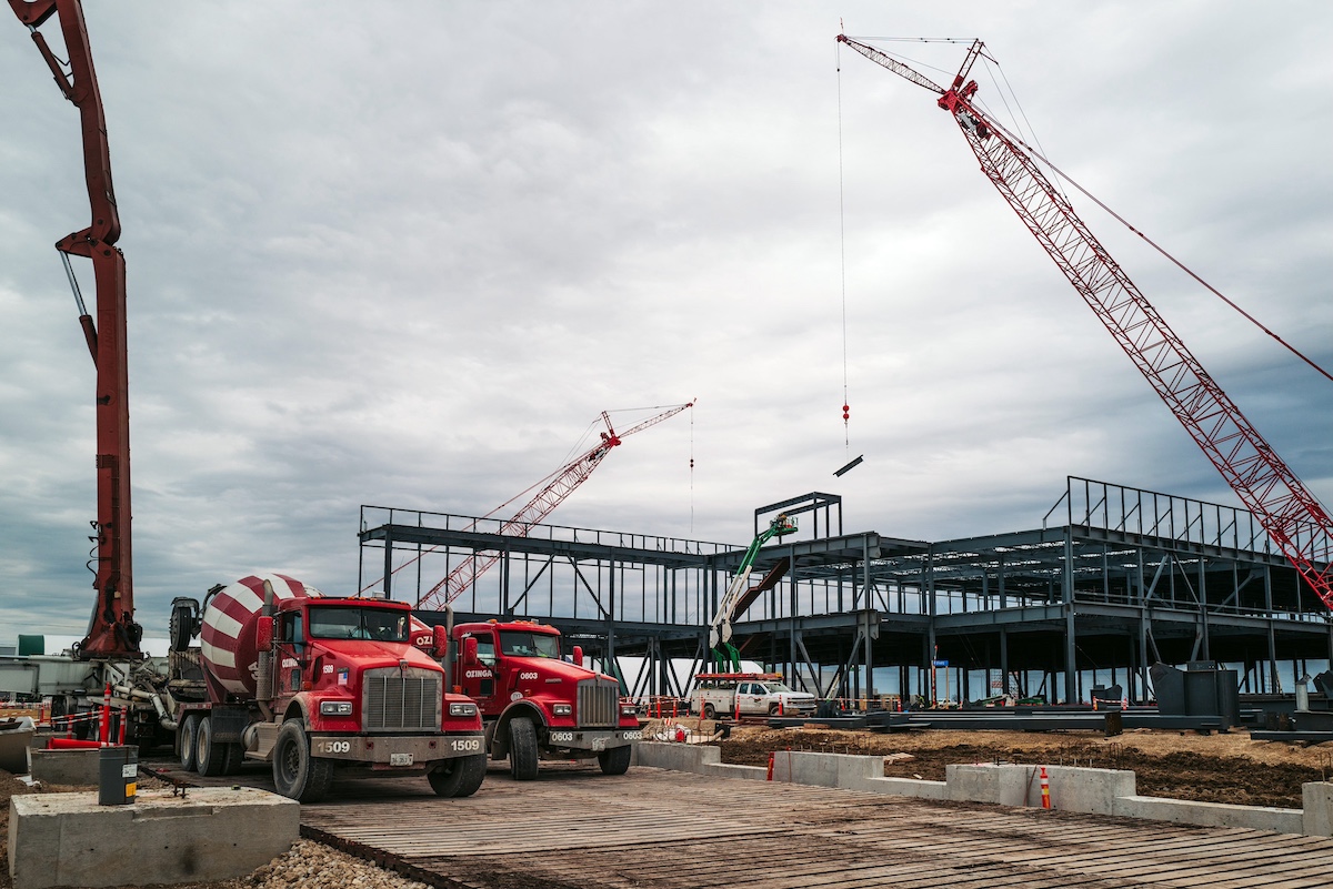 cement trucks and new building construction with cranes.