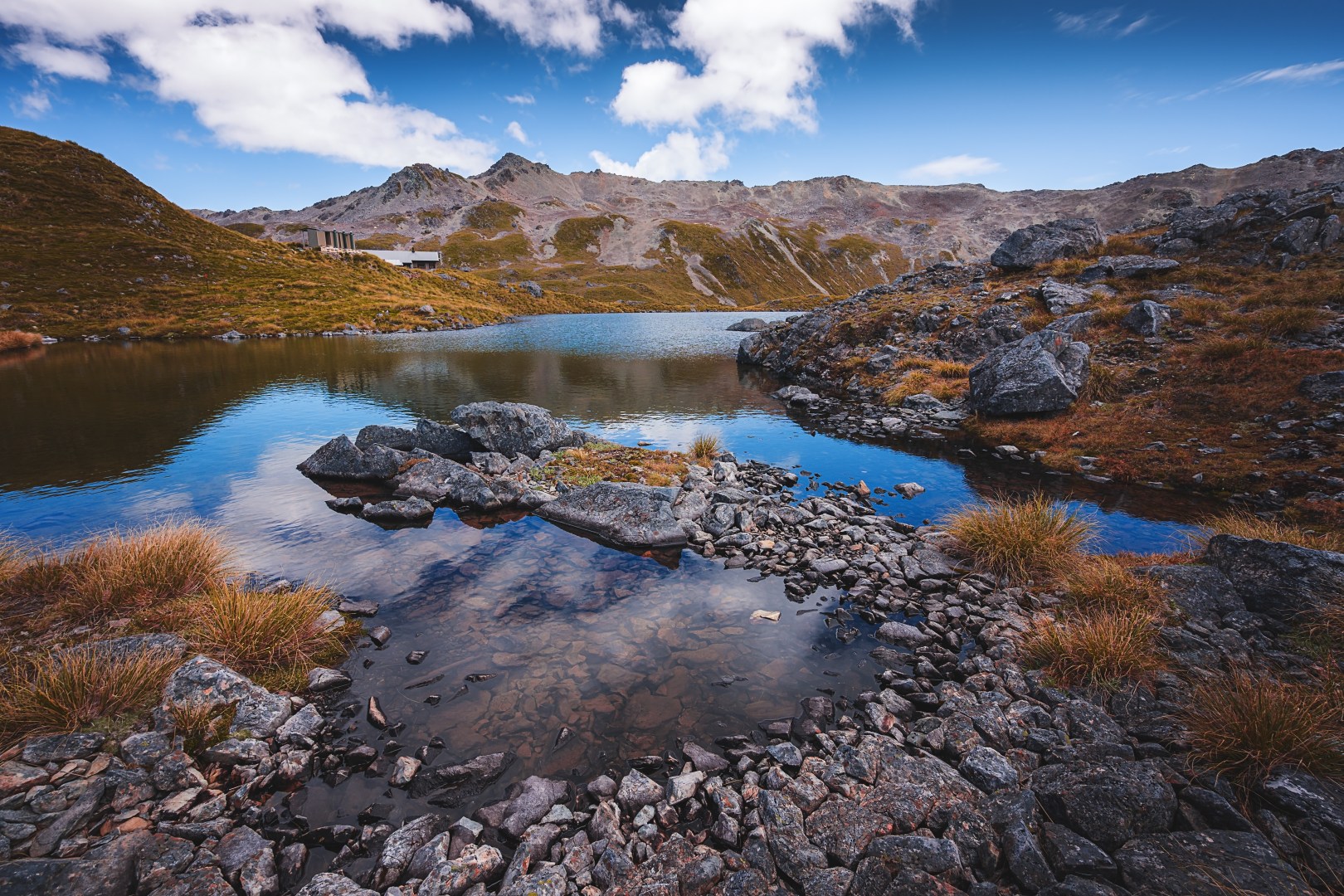 View of a river flowing downwards from a mountain peak
